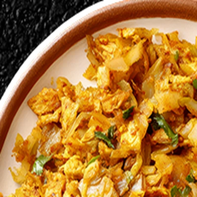 Chopped kottu rotti with vegetables in a rimmed bowl